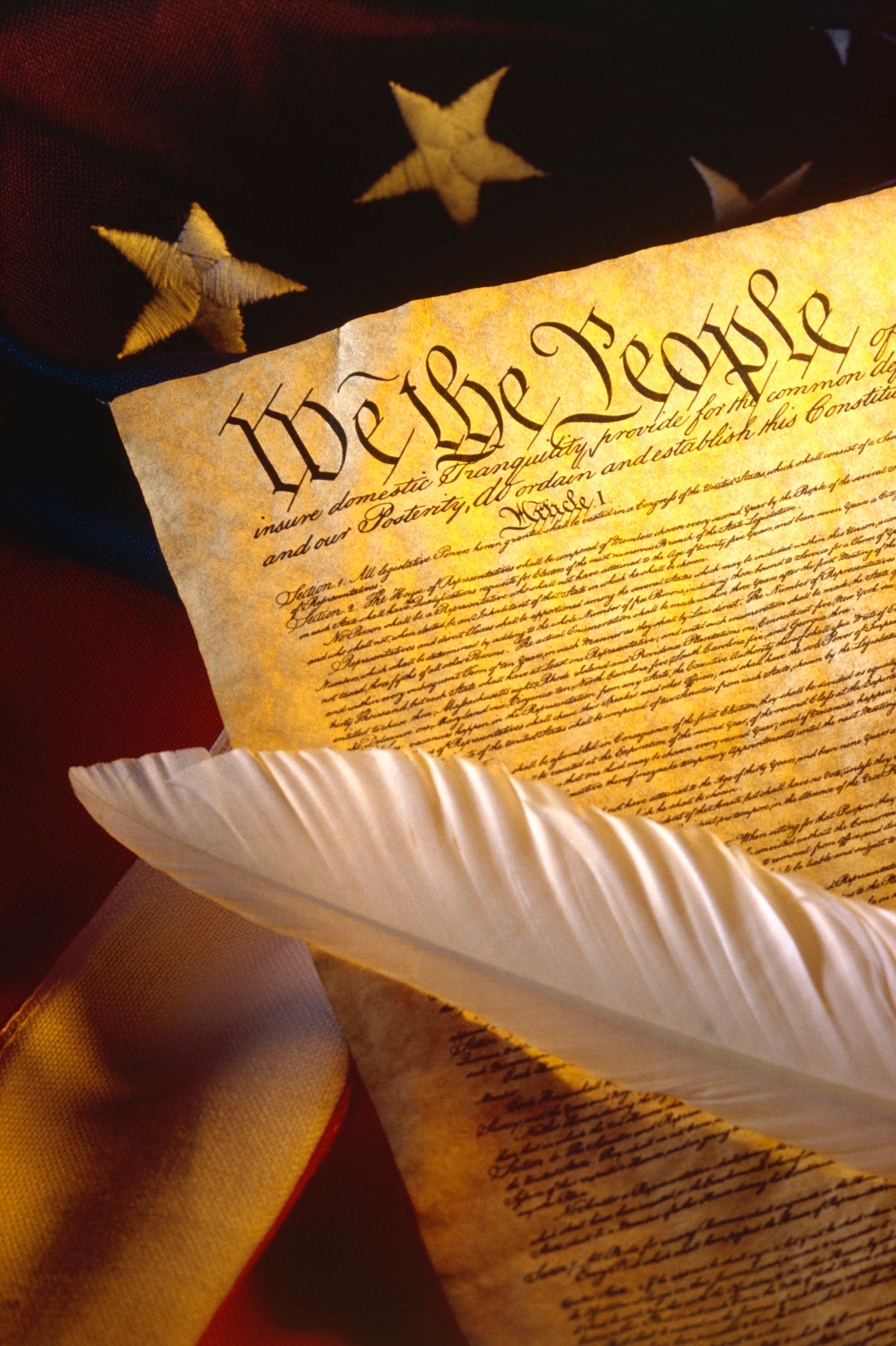 Bill of Rights with white feather quill and flag